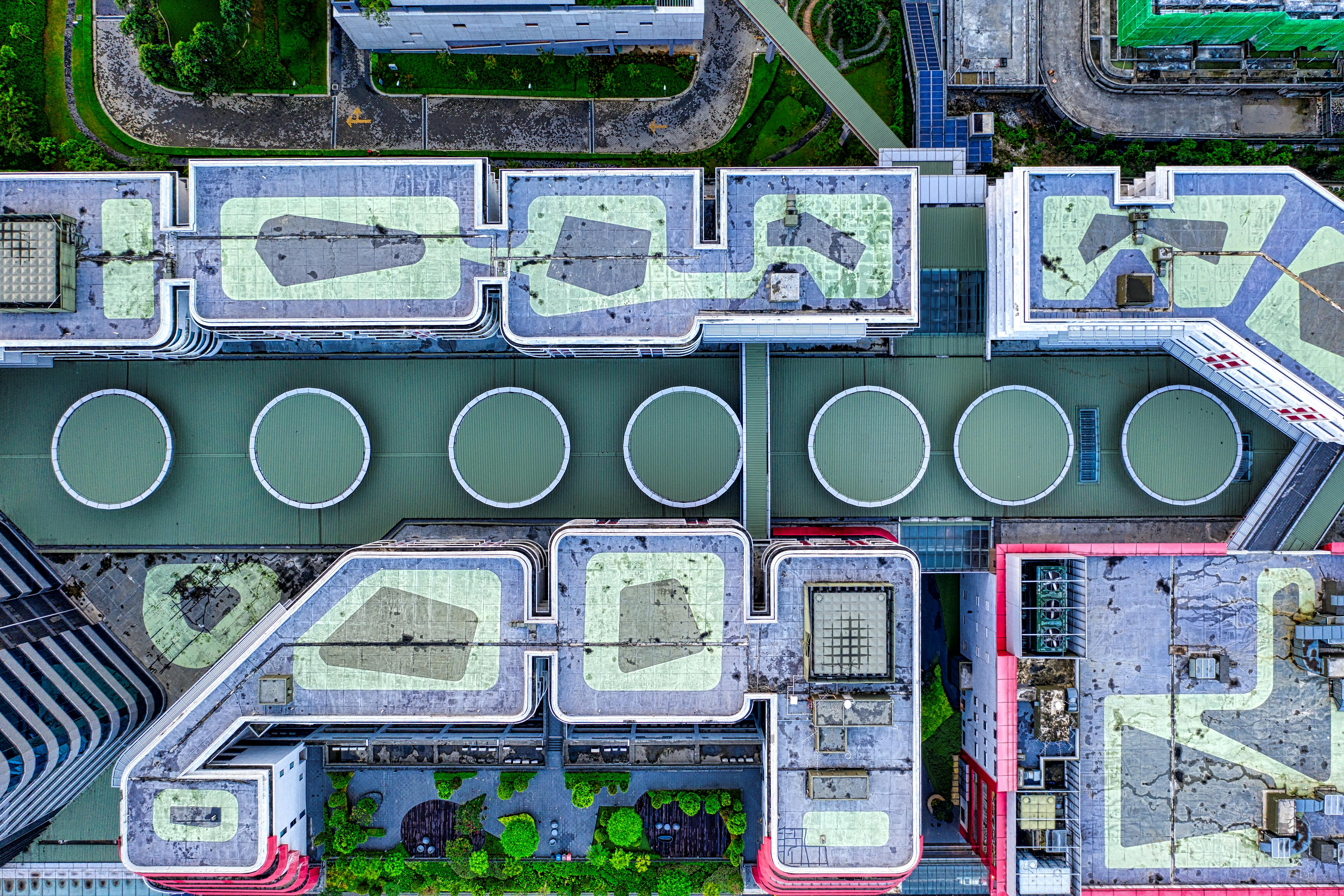 Top-down industrial campus and rooftop systems representing structured execution control