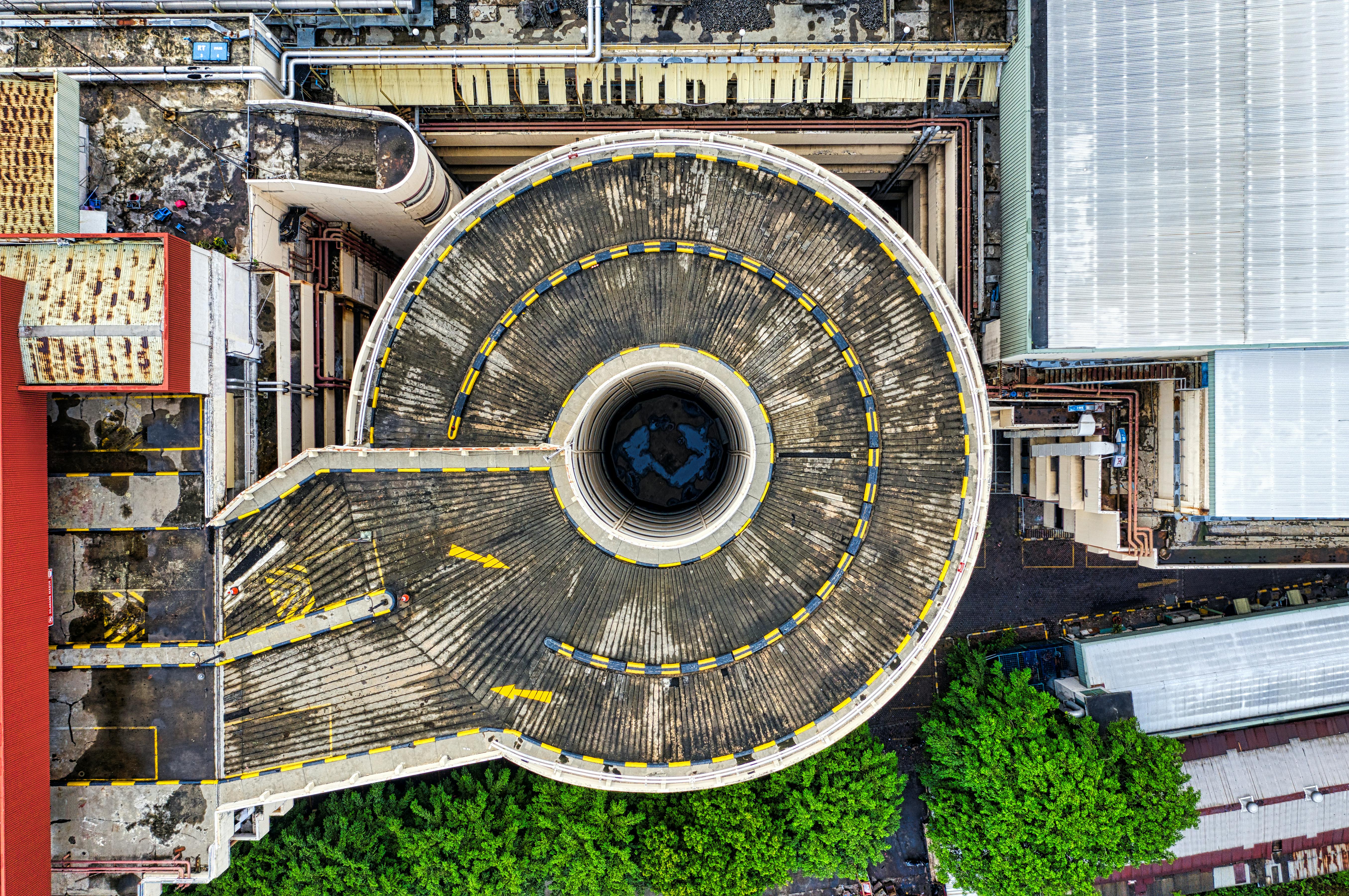 Top-down industrial cooling tower and surrounding process infrastructure