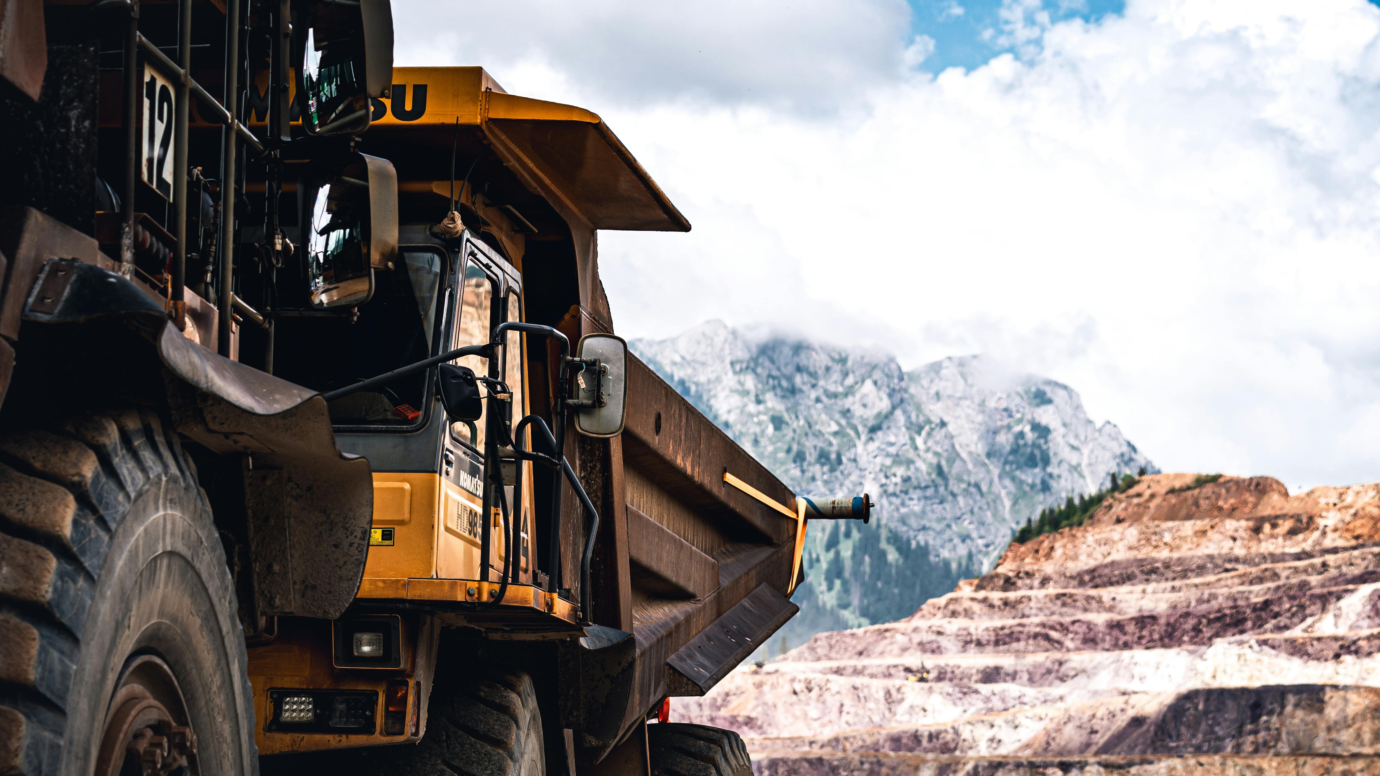Mining haul truck on an open-pit bench representing field-proven operating reality