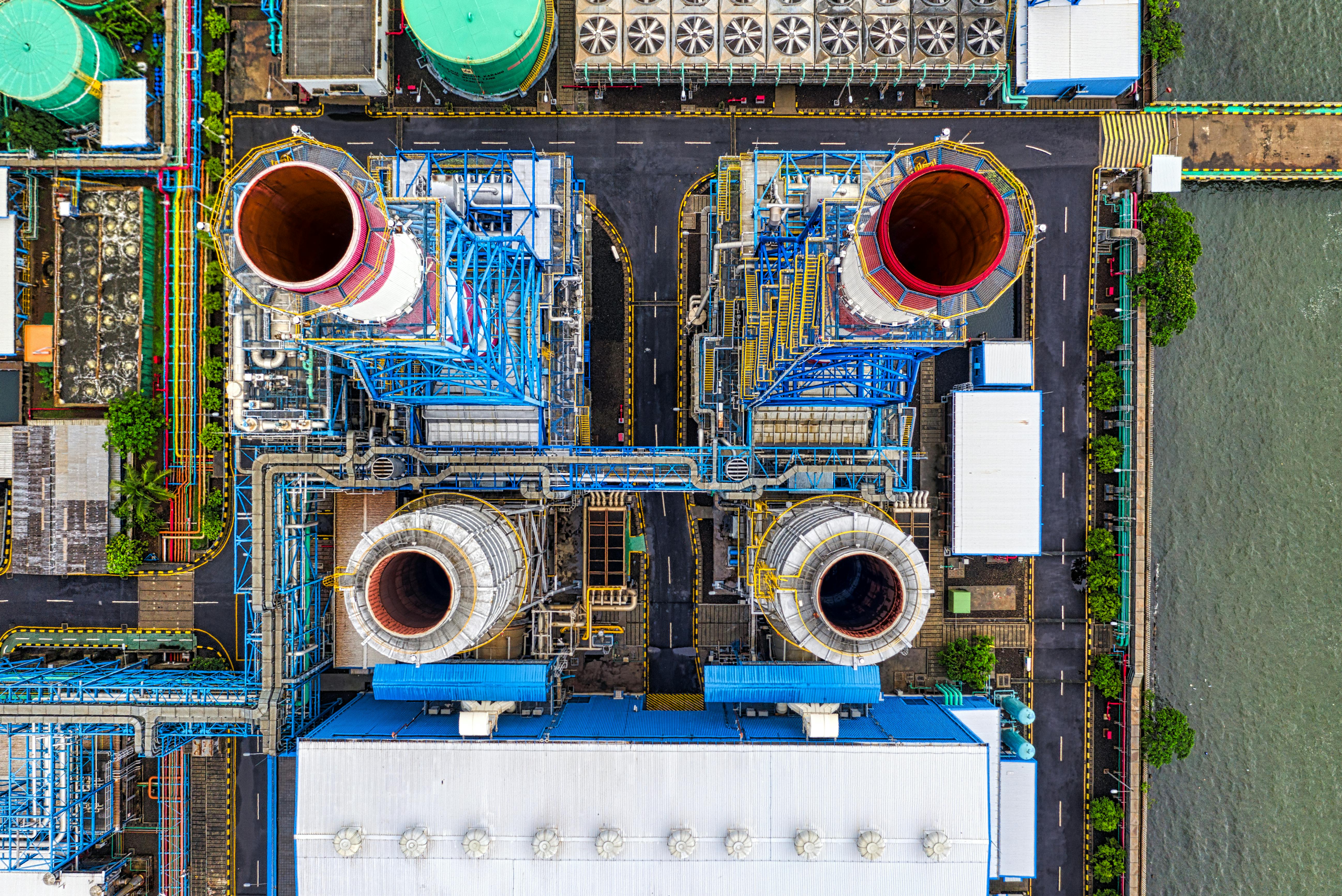 Aerial view of an industrial plant with cooling towers, process infrastructure, and utility systems